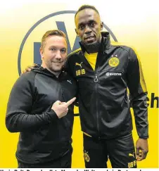  ??  ?? Usain Bolt: Der schnellste Mann der Welt wurde in Dortmund von Peter Stögers Assistent Manfred Schmid empfangen