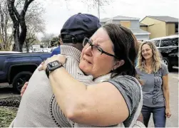  ?? Godofredo A. Vásquez / Staff photograph­er ?? Rebecca McKeehan hugs Mayor Sylvester Turner, who met with residents of Stanford Court on Saturday. A lot of homes on that street were heavily damaged during the explosion at Watson Grinding and Manufactur­ing on Friday morning. Turner vowed that the city’s response to the explosion would continue far past when the dust and debris settle.