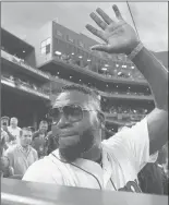  ?? MICHAEL DWYER/AP ?? Former Red Sox slugger David Ortiz waves to the crowd after throwing out a ceremonial first pitch before Monday’s game against the Yankees.