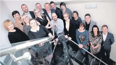  ??  ?? ●● Focus Management Consultant­s Limited co-founders Michael Staniland and Stephen Jones with staff. They now want to expand its team of 30 to 40 this year to achieve their growth ambitions