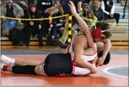  ?? AUSTIN HERTZOG - MEDIANEWS GROUP ?? Boyertown’s Gavin Sheridan works for back points on Souderton’s AJ Slayton during the 133-pound final at the District 1-3A North tournament on Feb. 25at Perkiomen Valley.