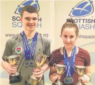  ??  ?? Silverware Kyle and Lucy with their trophies