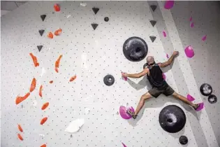  ?? PATRICK CONNOLLY/ORLANDO SENTINEL PHOTOS ?? Sergio Sanchez, of Maitland, climbs at Blue Swan Boulders in Orlando on Thursday.