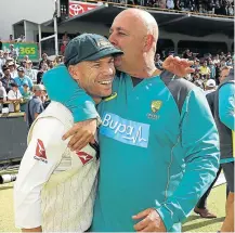  ?? Picture: RYAN PIERSE/GETTY IMAGES ?? SHARING THE PAIN: Disgraced former Australian batsman, David Warner, left, embraces former Australian head coach Darren Lehmann.