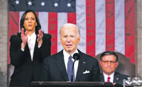  ?? SHAWN THEW/POOL PHOTO VIA THE ASSOCIATED PRESS ?? President Joe Biden delivers the State of the Union address to a joint session of Congress at the Capitol on Thursday. Standing at left is Vice President Kamala Harris and seated at right is House Speaker Mike Johnson, R-La. Biden’s speech focused on the economy, the border and the threat posed by his rival.