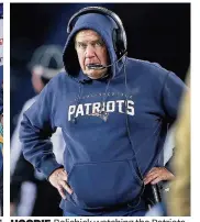  ??  ?? HOODIE Belichick watching the Patriots