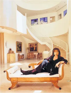  ??  ?? Left, Jackie in her LA party palace, where she hosted dinners for the stars of Hollywood. Most of its contents will be sold today, including a Josef Lorenzl statuette of a dancer, below, and her bespoke XKR gold Jaguar sports car, above