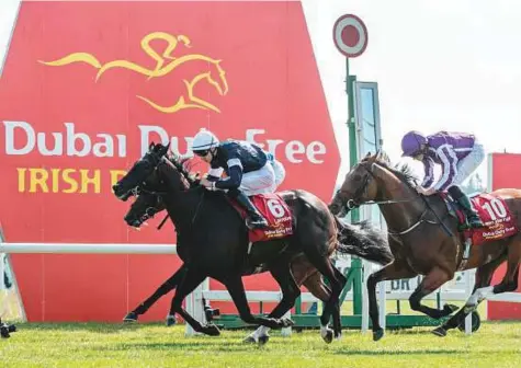  ?? Rex Features ?? Donnacha O’Brien, on Latrobe, as he wins the The Dubai Duty Free Irish Derby ahead of Rostropovi­ch and Saxon Warrior of at the Curragh Racecourse on Saturday.