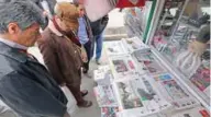  ?? — File photo ?? REBUTTAL: Iranians look at newspapers displayed outside a kiosk on November 24, 2013 in the capital Tehran a day after a deal was reached on the country’s nuclear programme.