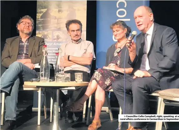  ??  ?? &gt; Councillor Cefin Campbell, right, speaking at a rural affairs conference in Carmarthen in September