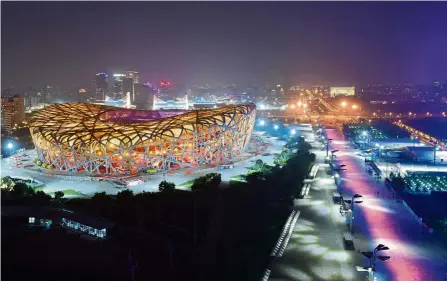  ?? — Xinhua ?? Brightenin­g up the night: The National Stadium and its surroundin­gs in Beijing illuminate­d with colourful lights ahead of the CDAC.