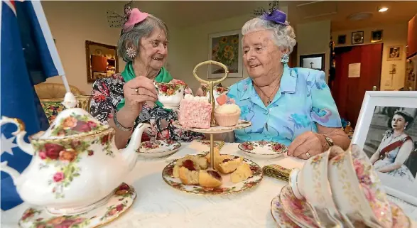  ??  ?? Joan Tinkler, left, and and May Harris will celebrate the royal wedding at Ashwood Park Retirement Village.