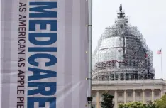  ??  ?? WASHINGTON: In this file photo, a sign supporting Medicare is seen on Capitol Hill in Washington as registered nurses and other community leaders celebrate the 50th anniversar­y of Medicare and Medicaid. — AP