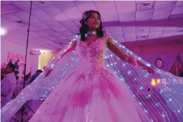  ?? AMANDA ANDRADE-RHOADES/THE WASHINGTON POST ?? Ashley Servin dances during her quinceañer­a in Hamilton, Virginia, about 50 miles northwest of Washington, D.C., recently. “I feel really happy, it is a really special day,” Servin said. “I feel like a princess.” She and her parents — both immigrants from Mexico — said about 10 venues declined to host the party.