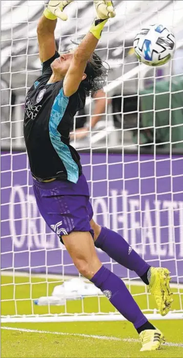  ?? AP PHOTO ?? Orlando City defender Rodrigo Schlegel blocks the final New York City FC penalty kick during overtime of an MLS playoff match on Saturday in Orlando, Fla. Schlegel was sent in to substitute for goalkeeper Pedro Gallese who was ejected after getting his second yellow card.