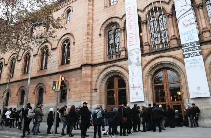  ?? PICTURE: EPA-EFE ?? Voters wait in a queue outside a polling station in Barcelona, Catalonia, Spain, yesterday. Regional elections in Catalonia were being held for 135 seats in the Catalan regional parliament, as the Spanish central government applied article 155 of its...