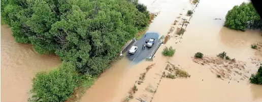  ?? HIGH COUNTRY HELICOPTER­S ?? The scene in Gore yesterday after three days of torrential rain. Motorists have been advised to avoid all but essential travel.