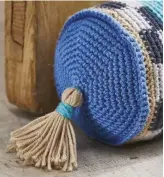  ??  ?? Pick out two of your favourite yarn colours from the design to make the end tassels.