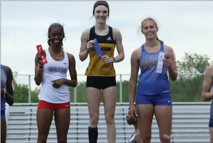  ?? Photo by Grace Scheumann ?? Adrienne McKean and Huntington North’s Addy Wiley were the stars at Tuesday’s track sectional at New Haven. South Adams’ McKean won the 100 M, the 200M and the high jump tho help the Starfires to a third-place finish.