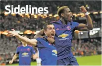  ??  ?? Manchester United’s Henrikh Mkhitaryan, left, celebrates scoring with teammate Paul Pogba during the Europa League final match between Ajax and Manchester United on Wednesday at the Friends Arena in Stockholm, Sweden. United won 2-0.