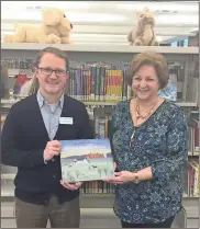  ??  ?? Catoosa County Farm Bureau Women’s Committee Chairman Andrea Sims recently presented a copy of the children’s book “Sleep Tight Farm” to Richard Groves, director of the Catoosa County Library. The donation was made on behalf of the Georgia Farm Bureau...