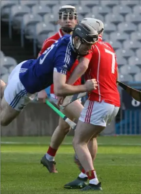  ??  ?? Joe Sutton of Fethard stopping an Ardmore opponent firmly in his tracks.