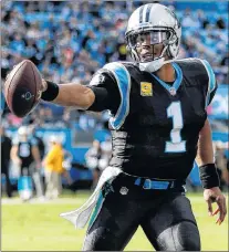  ?? AP PHOTO ?? Carolina Panthers quarterbac­k Cam Newton runs with the football against the Tampa Bay Buccaneers Sunday in Charlotte, N.C.