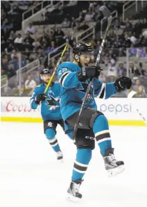  ?? Marcio Jose Sanchez / Associated Press ?? Kevin Labanc celebrates after scoring one of the Sharks’ four second-period goals in their exhibition opener.