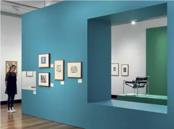  ??  ?? Above — Bauhaus Now features original artworks, including work by Ludwig Hirschfeld-mack and Frank Hinder (on blue wall).