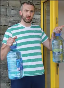  ??  ?? Niall Rohan has to buy large quantities of bottled water because of the very poor quality of water in Ballydesmo­nd Village.