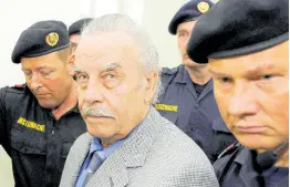  ?? AP ?? FILE – Defendant Josef Fritzl (centre) is escorted to the fourth day of his trial in the provincial courthouse in St Poelten, Austria, Thursday, March 19, 2009.