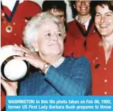  ??  ?? WASHINGTON: In this file photo taken on Feb 06, 1992, former US First Lady Barbara Bush prepares to throw a rugby ball. — AFP