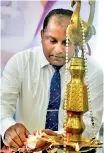  ??  ?? Lanka Hospitals Group Chief Executive Officer Dr. Prasad Medawatte lighting the oil lamp during the opening ceremony of the Lanka Hospitals Patient Informatio­n Centre in Jaffna