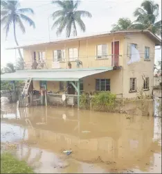  ??  ?? The compound of the Fellowship Post Office was yesterday afternoon seen inundated as a result of the high tides. (Shamar Meusa photo)