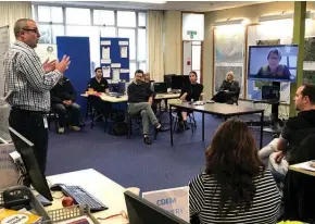  ??  ?? Whanganui District Council Recovery Manager, Leighton Toy (left), in a Recovery Office team briefing earlier this week