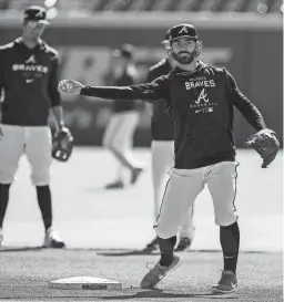  ?? BRETT DAVIS/USA TODAY SPORTS ?? Braves shortstop Dansby Swanson throws to first base during a team workout on Monday in Atlanta.