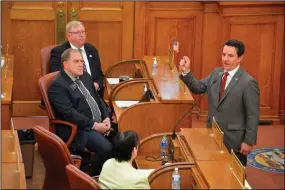  ?? (AP/Pierre Capital Journal/Jorge Encinas) ?? Republican state Rep. Will Mortenson talks to fellow South Dakota House members during the impeachmen­t hearing for Attorney General Jason Ravnsborg on Tuesday in Pierre.