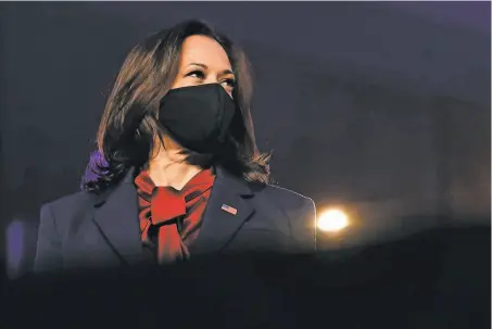  ?? Carolyn Kaster / Associated Press ?? Sen. Kamala Harris, on the brink of becoming the first female vice president, listens as Joe Biden speaks in Wilmington, Del.