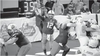  ?? KARL MERTON FERRON/BALTIMORE SUN ?? Quarterbac­k Randy Hippeard passes against the Soul during the Brigade’s win in the Arena Football League semifinals July 20 at Royal Farms Arena. Philadelph­ia defeated Hippeard’s Tampa Bay Storm, now defunct, in last year’s ArenaBowl XXX.