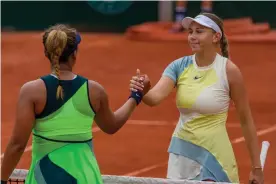  ?? Photograph: Andy Cheung/Getty Images ?? Amanda Anisimova shakes hands with Naomi Osaka after winning their first-round encounter.