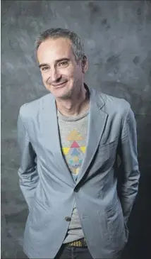  ?? Jay L. Clendenin Los Angeles Times ?? OLIVIER ASSAYAS sets his movies in far-f lung locations.