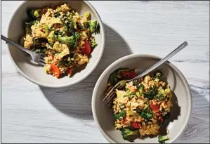  ?? Stacy Zarin Goldberg/Washington Post ?? Fried rice with broccoli and mustard greens.