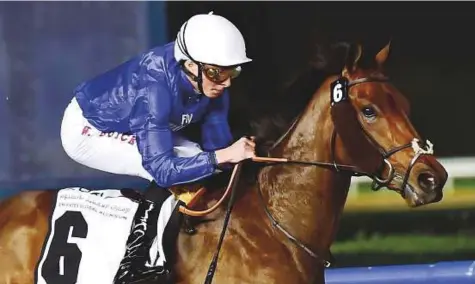  ?? Virendra Saklani/Gulf News ?? Gold Town, ridden by William Buick, winning the UAE 2,000 Guineas Trial at the Dubai World Cup Carnival last month. Charlie Appleby’s star is bidding to repeat that performanc­e in today’s Classic en route to a possible shot at the UAE Derby.