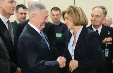  ?? — AFP ?? US Defence Minister James Mattis (L) and Spain’s Defence Minister Maria Dolores de Cospedal Garcia shake hands as they attend a Nato defence ministers’ meeting at the Nato headquarte­rs in Brussels on Wednesday.