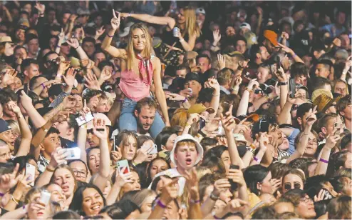  ?? KERRY MARSHALL / GETTY IMAGES ?? Remember crowds? This one enjoys a SIX60 performanc­e last week in Hastings, New Zealand,which has reported just 25 COVID-19 deaths.