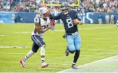  ?? Mark Zaleski / Associated Press ?? Titans QB Marcus Mariota had four touchdown passes and one rushing vs. the Cowboys and Pats.