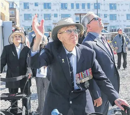  ?? JEAN LEVAC POSTMEDIA ?? Second World War veteran Andy Carswell, 96, and his son John, watch the flypast of a Canso PBY during the cornerston­e laying ceremony of the Veterans' House Canso Campus in Ottawa, Andy's wife, Dorothy, 98, is at left. •
