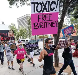  ??  ?? Family battle...Britney with dad Jamie, whose control she is trying to have removed, as fans highlight her fight, above