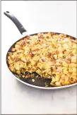  ??  ?? Extracrisp­y skillet stuffing: This stuffing has the traditiona­l flavors of onion, celery, sage and thyme. The crispy, crunchy texture sets it apart.