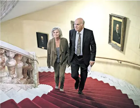  ??  ?? Sir Vince arrives at the National Liberal Club with his wife Rachel Smith yesterday before announcing his party reforms